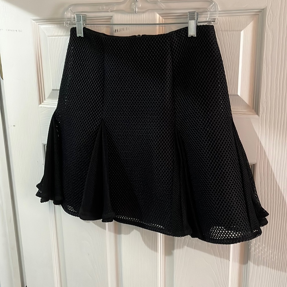 Flirty black skirt with pleated flair hem.  Like new
